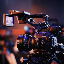 pexels-photo-2873486-2873486 Close-up of a professional video camera setup indoors, capturing high-quality footage.